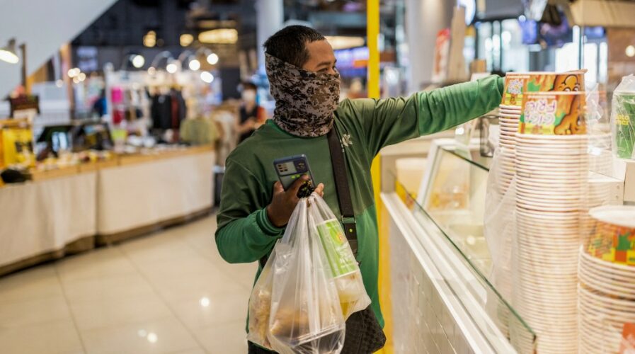Digital trust in businesses are predicated on multiple factors, most notably service reliability, at least, in Asia. (Photo by Jack TAYLOR / AFP)
