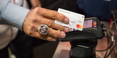 A Mastercard contactless terminal being used at the baseball World Series.