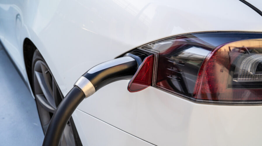 A Tesla Model X electric car is being charged at a Tesla Supercharger Station. Korea's EV battery manufacturers counts Tesla amongst its billion-dollar clients. (IMG/Shutterstock)